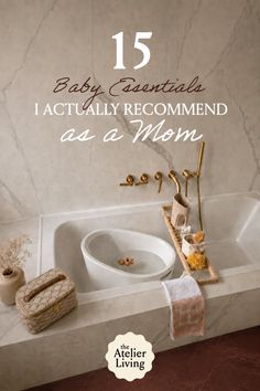 A bathroom with a baby bathtub inside a larger tub, with gold fixtures and marble walls