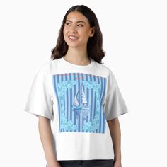 Woman in a white t-shirt with a sailboat and blue stripes design