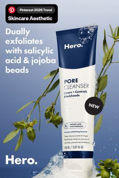 Skincare product with salicylic acid and jojoba beads on a blue background with leaves