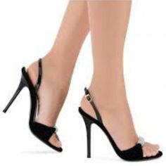 Pair of black high heels with a jeweled strap on a white background