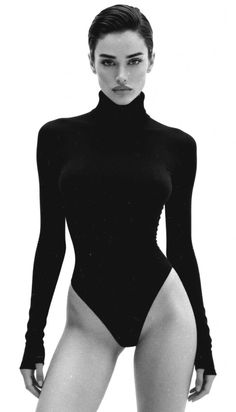 Woman in a black turtleneck bodysuit with short hair, black and white photograph