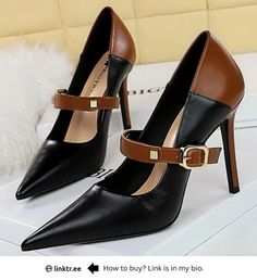 Pair of brown and black high heels with ankle straps