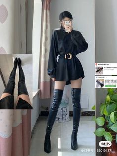 Woman in a black shirt dress and thigh-high boots taking a mirror selfie