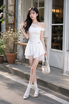Woman in a white off-shoulder dress with lace trim and white socks outdoors