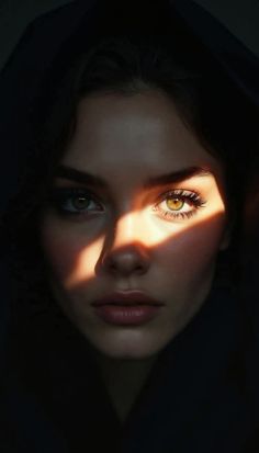 Close up portrait of a woman with dark hair and dramatic lighting on her face