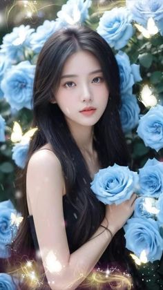 Woman with long black hair holding blue roses with glowing butterflies