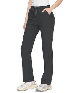 Person wearing dark gray drawstring pants and white sneakers