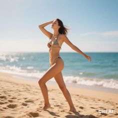 Woman in a bikini walking on a sandy beach with the ocean in the background