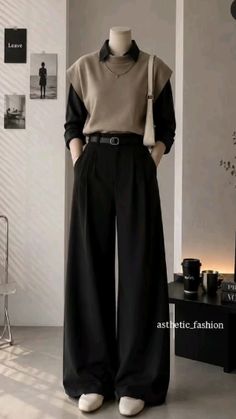 Mannequin wearing a collared shirt, sweater vest, wide leg pants, and shoulder bag