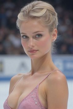 Woman with blonde hair in an updo wearing a sparkling pink dress