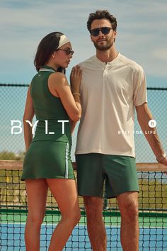 Couple in athletic wear on a tennis court during the daytime