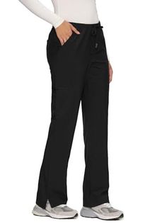Person wearing black pants with a drawstring waist and a white long sleeve shirt