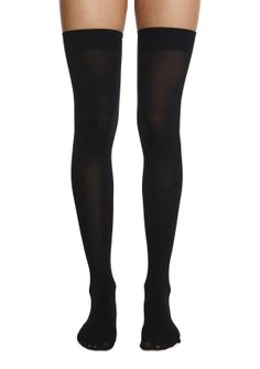 Pair of legs wearing black thigh-high stockings against a white background