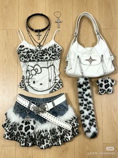 Leopard print top and mini skirt with a white handbag and cross jewelry