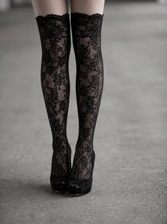 Woman wearing black lace stockings and peep-toe heels