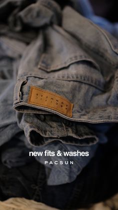 Close up of denim fabric with a brown leather clothing tag