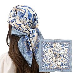 Woman with long hair wearing a blue floral patterned hair scarf