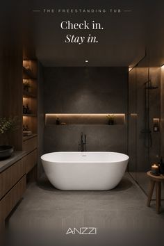 Modern bathroom with a freestanding tub and dark, warm lighting