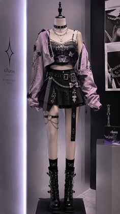 Mannequin displaying a gothic-inspired outfit with a pleated skirt and crop top