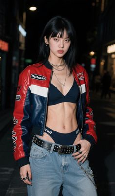 Woman in a red, white, and blue jacket with jeans and exposed midriff on a street at night