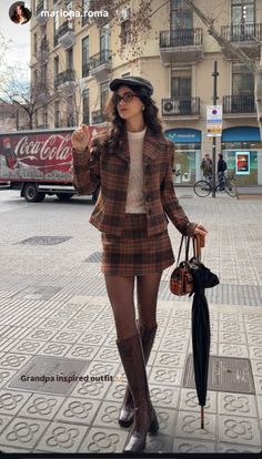 Woman in a plaid suit and mini skirt on a city street