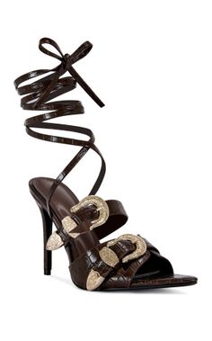 Brown leather high heels with ankle straps and gold buckles
