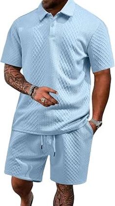 Man wearing a light blue textured polo shirt and matching shorts