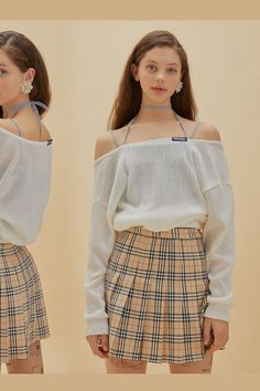 Young woman in a plaid skirt and off-shoulder top with a choker