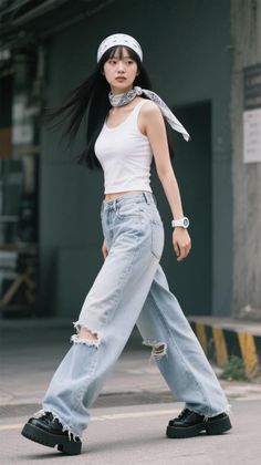 Woman with long black hair wearing a bandana, white tank top, and ripped jeans