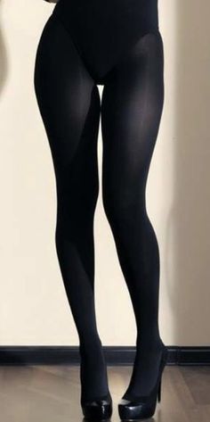 Person wearing black tights and high heels indoors