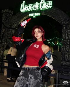 Woman with red hair in a racing jacket and crop top at night