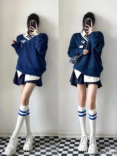 Person in a blue sweater, white shirt, mini skirt, and knee-high socks