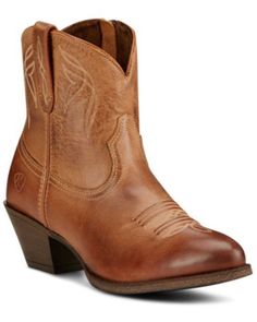 Single brown leather cowboy boot with embroidered details on a white background