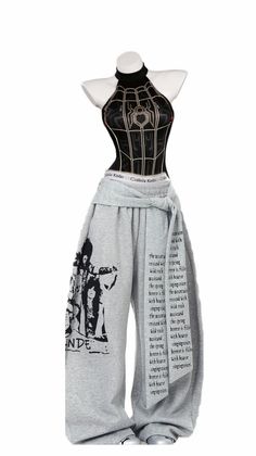 Mannequin wearing a black halter top with a spider web pattern and gray sweatpants