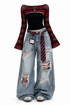 Full body shot of a fashion outfit with ripped jeans and a crochet top