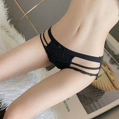 Woman in black lingerie with exposed skin and a provocative pose