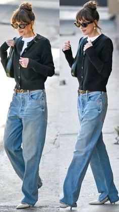 Woman with a bun hairstyle and sunglasses wearing a cardigan and wide leg jeans