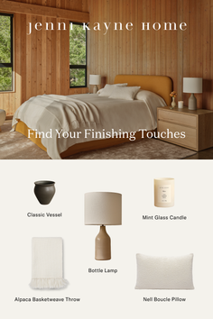 A cozy bedroom with wooden walls, large windows, and minimalist decor