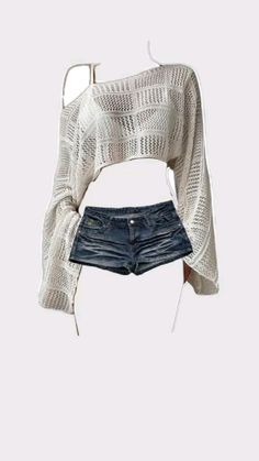 White crochet long-sleeve top with denim shorts on a white background