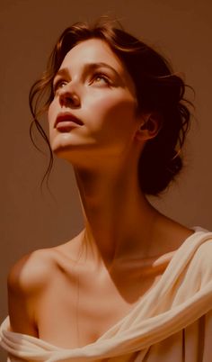 Woman with an updo and warm lighting looking upwards