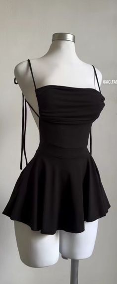 Black strapless mini dress on a white mannequin against a plain background