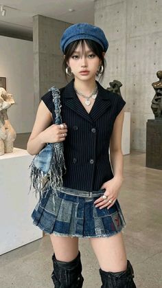 Woman in a denim beret and patchwork skirt posing indoors