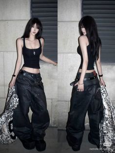 Woman with long black hair in a black tank top and baggy pants holding a leopard print bag