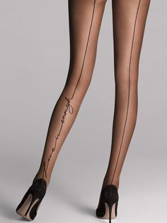 Woman's legs in sheer tights with a text design and high heels