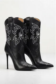 Pair of black leather cowboy boots with white stitching and high heels
