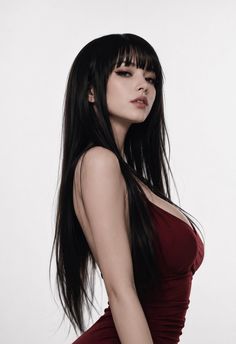 Woman with long black hair and dark makeup in a red dress