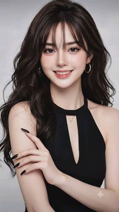 Woman with long dark hair and a black dress smiling at the camera