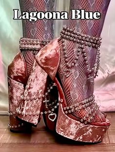 Close up of platform heels with beaded chains and fishnet stockings