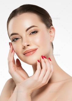 Woman with red nails and glossy lips posing against a white background