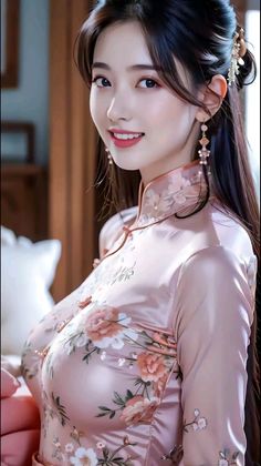 Woman in a pink floral cheongsam with long dark hair and earrings